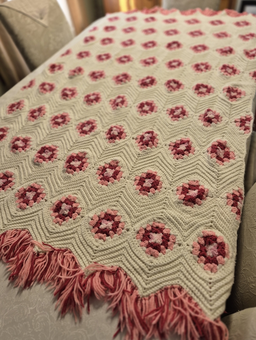 Handmade Crotchet blanket features a vibrant flower Motif